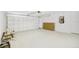 Spacious garage with white walls and ample storage at 340 Edgewood Ct, Kissimmee, FL 34759