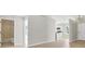 Open-concept space with light wood floors connecting the living room, kitchen, and bathroom at 340 Edgewood Ct, Kissimmee, FL 34759