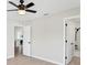 Spacious main bedroom with ceiling fan, light walls, and an ensuite bathroom at 340 Edgewood Ct, Kissimmee, FL 34759