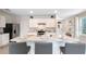 Open concept kitchen with large island and breakfast bar seating at 3519 Mcway Falls Ct, Davenport, FL 33837