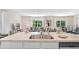 Bright open-concept design from kitchen island to living room and dining area at 3519 Mcway Falls Ct, Davenport, FL 33837