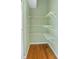 Walk-in closet featuring built in wire shelving and wood floors, painted in a pleasant light green at 3593 Scoutoak Loop, Oviedo, FL 32765