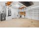 Spacious garage with workbench and shelving at 3593 Scoutoak Loop, Oviedo, FL 32765