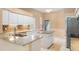Kitchen featuring granite countertops, stainless steel appliances, and a tile backsplash at 3593 Scoutoak Loop, Oviedo, FL 32765