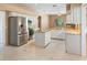 Bright kitchen featuring stainless steel appliances, tile floors, an island, and granite countertops at 3593 Scoutoak Loop, Oviedo, FL 32765