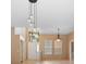 Open-concept living area with modern globe lighting, neutral walls, and tile flooring at 3593 Scoutoak Loop, Oviedo, FL 32765