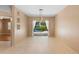Bright living room with tile floors and sliding glass doors leading to the lanai and pool area at 3593 Scoutoak Loop, Oviedo, FL 32765