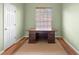 Study area with a large wooden desk and natural lighting from a nearby window at 3593 Scoutoak Loop, Oviedo, FL 32765