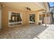 Covered patio featuring brick pavers, ceiling fan and sliding glass doors for indoor/outdoor living at 3593 Scoutoak Loop, Oviedo, FL 32765