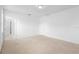 Bright bedroom featuring carpet flooring, ensuite bathroom, and neutral color palette at 417 Tisone Ln, Davenport, FL 33837