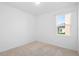 This bedroom features carpet, a window with natural light, and neutral paint at 417 Tisone Ln, Davenport, FL 33837