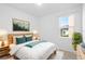 Comfortable bedroom with a queen-sized bed, bright natural light, and stylish decor at 417 Tisone Ln, Davenport, FL 33837