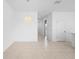 Open dining area with tile flooring and access to other rooms at 417 Tisone Ln, Davenport, FL 33837