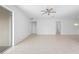 Spacious living room with tile flooring, ceiling fan, and recessed lighting at 417 Tisone Ln, Davenport, FL 33837