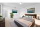 Serene main bedroom features a king-sized bed, contemporary decor, and an en-suite bathroom at 417 Tisone Ln, Davenport, FL 33837