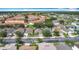 Aerial view of a well-planned residential neighborhood with manicured lawns and mature trees at 4611 Cumbrian Lakes Dr, Kissimmee, FL 34746