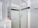 Updated bathroom with a glass-enclosed shower and neutral tile; bright and clean design at 4611 Cumbrian Lakes Dr, Kissimmee, FL 34746