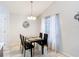 Dining room features modern furnishings and ample natural light from a large window at 4611 Cumbrian Lakes Dr, Kissimmee, FL 34746