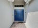 Inviting entryway with a double door entrance, brick pavers, and transom window providing natural light at 4611 Cumbrian Lakes Dr, Kissimmee, FL 34746