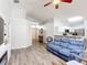 Bright living room shows an open floor plan with wood flooring and neutral colors at 4611 Cumbrian Lakes Dr, Kissimmee, FL 34746