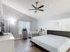 Bright main bedroom featuring a ceiling fan, crib and window with a sheer curtain at 4611 Cumbrian Lakes Dr, Kissimmee, FL 34746