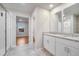 Bathroom with double sink, granite counters, tile floors, and a modern glass-enclosed shower at 491 Whistling Duck Trl, St Cloud, FL 34771