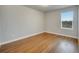 Bright bedroom with wood flooring and a large window that provides natural light at 491 Whistling Duck Trl, St Cloud, FL 34771