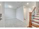 Bright entryway featuring tile floors, staircase with wooden banister, and neutral paint at 491 Whistling Duck Trl, St Cloud, FL 34771