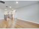 Upstairs hallway featuring wood flooring and a staircase with a modern iron railing at 491 Whistling Duck Trl, St Cloud, FL 34771
