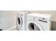 Bright laundry room featuring a modern washer and dryer for convenient chores at 491 Whistling Duck Trl, St Cloud, FL 34771