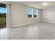 Bright living room with tile floors and sliding doors that open to the outdoors at 491 Whistling Duck Trl, St Cloud, FL 34771