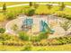 Community playground with modern, colorful equipment and ample green space for children to play at 491 Whistling Duck Trl, St Cloud, FL 34771