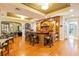 Stylish bar area featuring wood finishes, ample seating, and well-equipped appliances at 500 Mirasol Cir # 203, Celebration, FL 34747