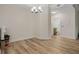 Bright dining area featuring stylish lighting and hardwood floors and a view to the bathroom at 500 Mirasol Cir # 203, Celebration, FL 34747