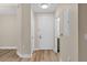 Welcoming home foyer featuring light walls, modern flooring, and a view of the bathroom at 500 Mirasol Cir # 203, Celebration, FL 34747