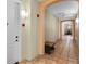 Beautiful hallway with neutral walls, stylish archways, and tiled flooring at 500 Mirasol Cir # 203, Celebration, FL 34747