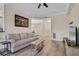 Comfortable living room highlighting wood floors, neutral colors, and a spacious layout at 500 Mirasol Cir # 203, Celebration, FL 34747