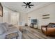 Bright living room featuring modern flooring, comfortable seating, and a ceiling fan at 500 Mirasol Cir # 203, Celebration, FL 34747