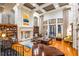 Stunning lobby featuring high ceilings, elegant decor, a cozy seating area, and a grand piano at 500 Mirasol Cir # 203, Celebration, FL 34747