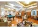 Beautifully designed lounge featuring a pool table, comfortable seating, and elegant decor at 500 Mirasol Cir # 203, Celebration, FL 34747