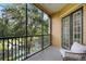 Beautiful view from the patio with outdoor seating area, overlooking a serene lake and lush greenery at 500 Mirasol Cir # 203, Celebration, FL 34747