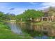 Stunning property by the pond, featuring well-maintained landscaping and building at 500 Mirasol Cir # 203, Celebration, FL 34747