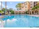 Resort-style pool area with comfortable seating and lush landscaping, perfect for relaxation at 500 Mirasol Cir # 203, Celebration, FL 34747