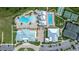An aerial view displaying a pool, tennis courts, and the clubhouse at 5081 Twin Lakes Blvd, St Cloud, FL 34772
