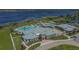 Aerial view showcases the clubhouse with multiple amenities including pools, tennis courts, and waterfront views at 5081 Twin Lakes Blvd, St Cloud, FL 34772