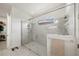 Modern bathroom featuring a glass enclosed shower with gray tiles and a convenient built-in niche at 5081 Twin Lakes Blvd, St Cloud, FL 34772