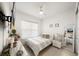 Well-lit bedroom with a ceiling fan, a comfortable bed, and bright walls at 5081 Twin Lakes Blvd, St Cloud, FL 34772