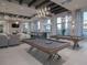 Lounge area features billiard tables, comfortable seating, stylish lighting, and bar area for gatherings at 5081 Twin Lakes Blvd, St Cloud, FL 34772