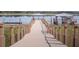 Scenic boardwalk leading to covered boat slips on the tranquil lake at 5081 Twin Lakes Blvd, St Cloud, FL 34772