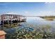Scenic waterfront dock with covered boat slips offering direct access to the lake at 5081 Twin Lakes Blvd, St Cloud, FL 34772